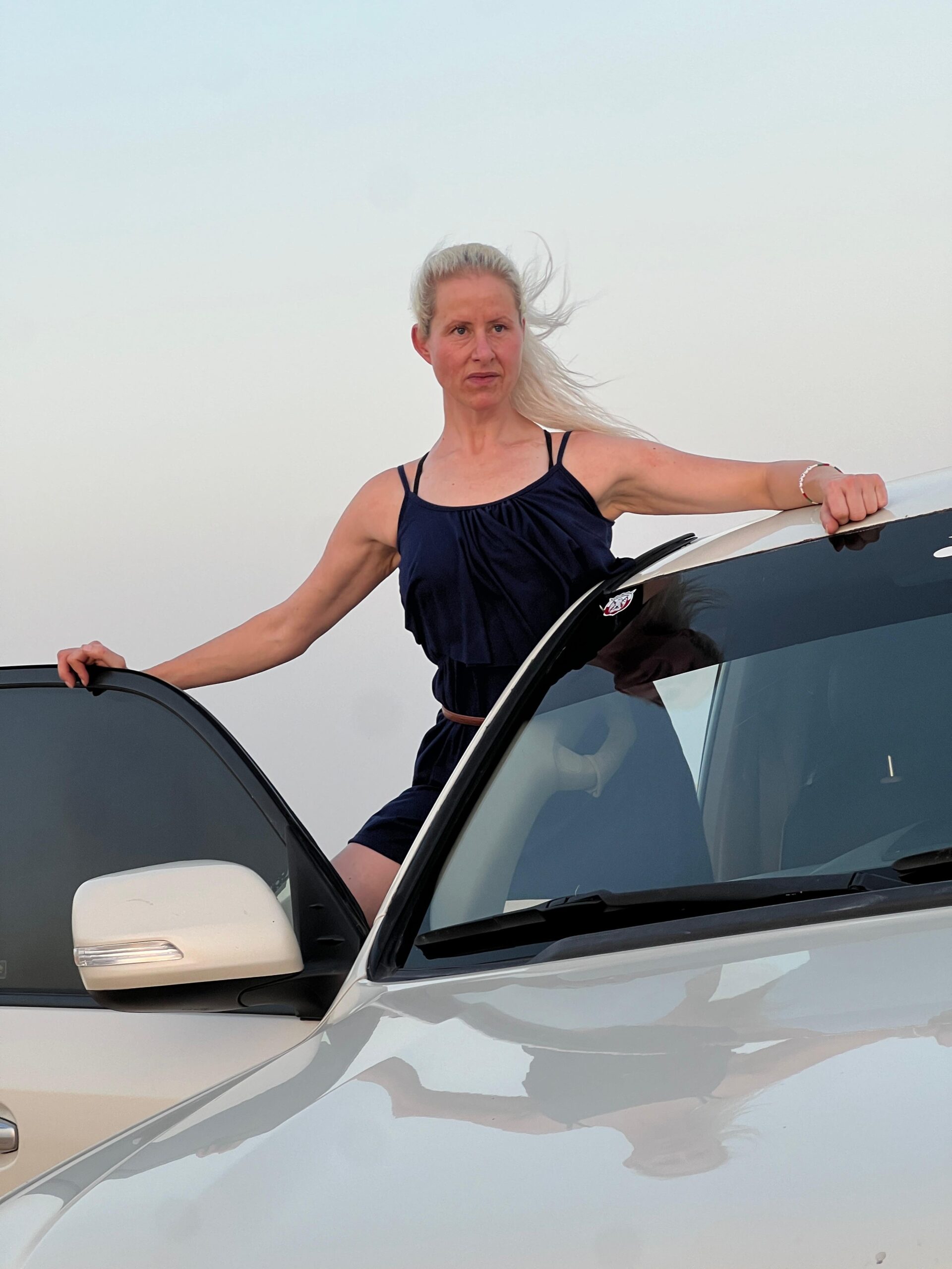 A talented belly dancer performing a solo routine under the stars at a traditional desert camp