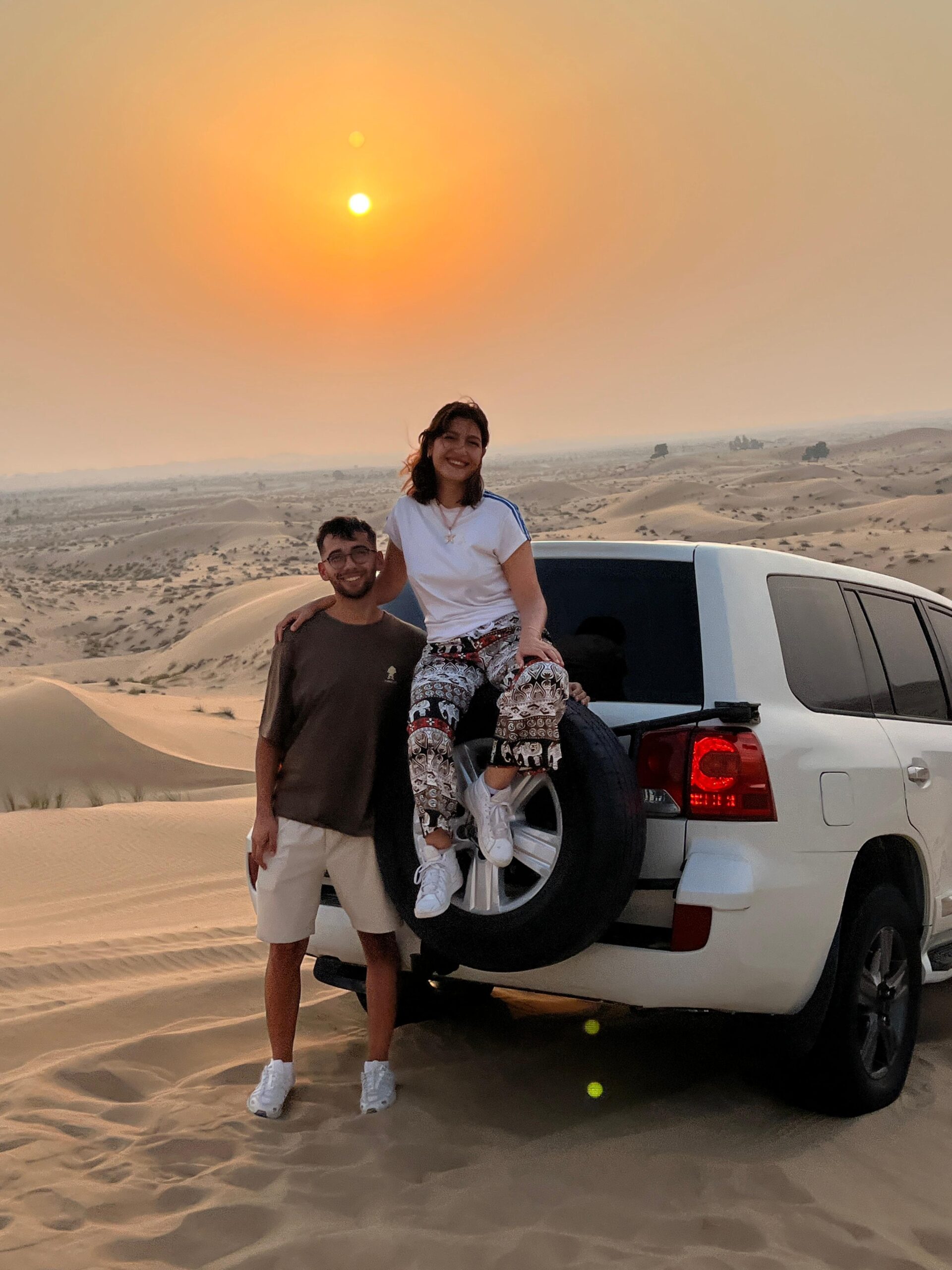 Enjoying a peaceful camel ride during the beautiful sunset hours in Abu Dhabi desert